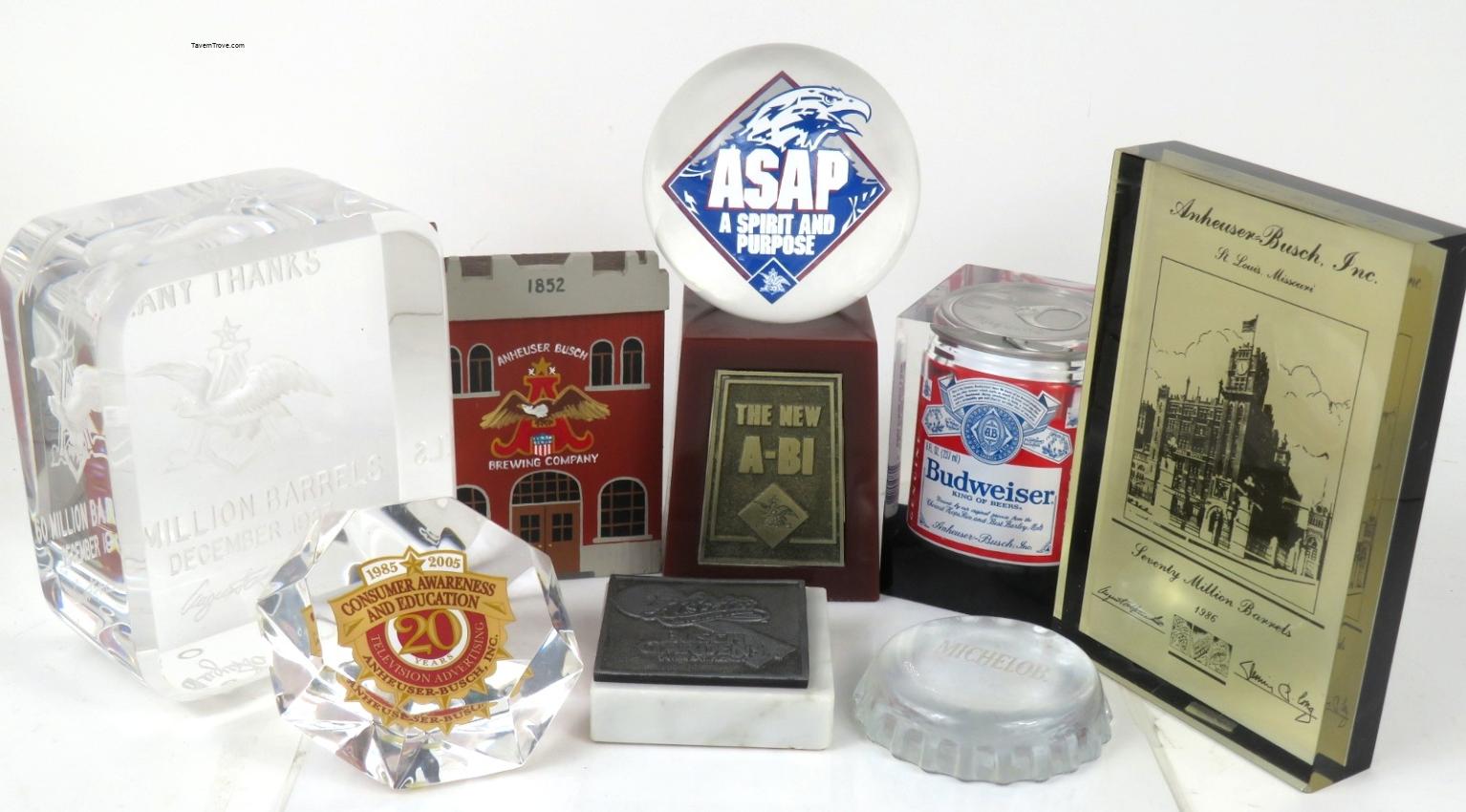 Anheuser Busch Paperweights and Trophies Lot of Eight