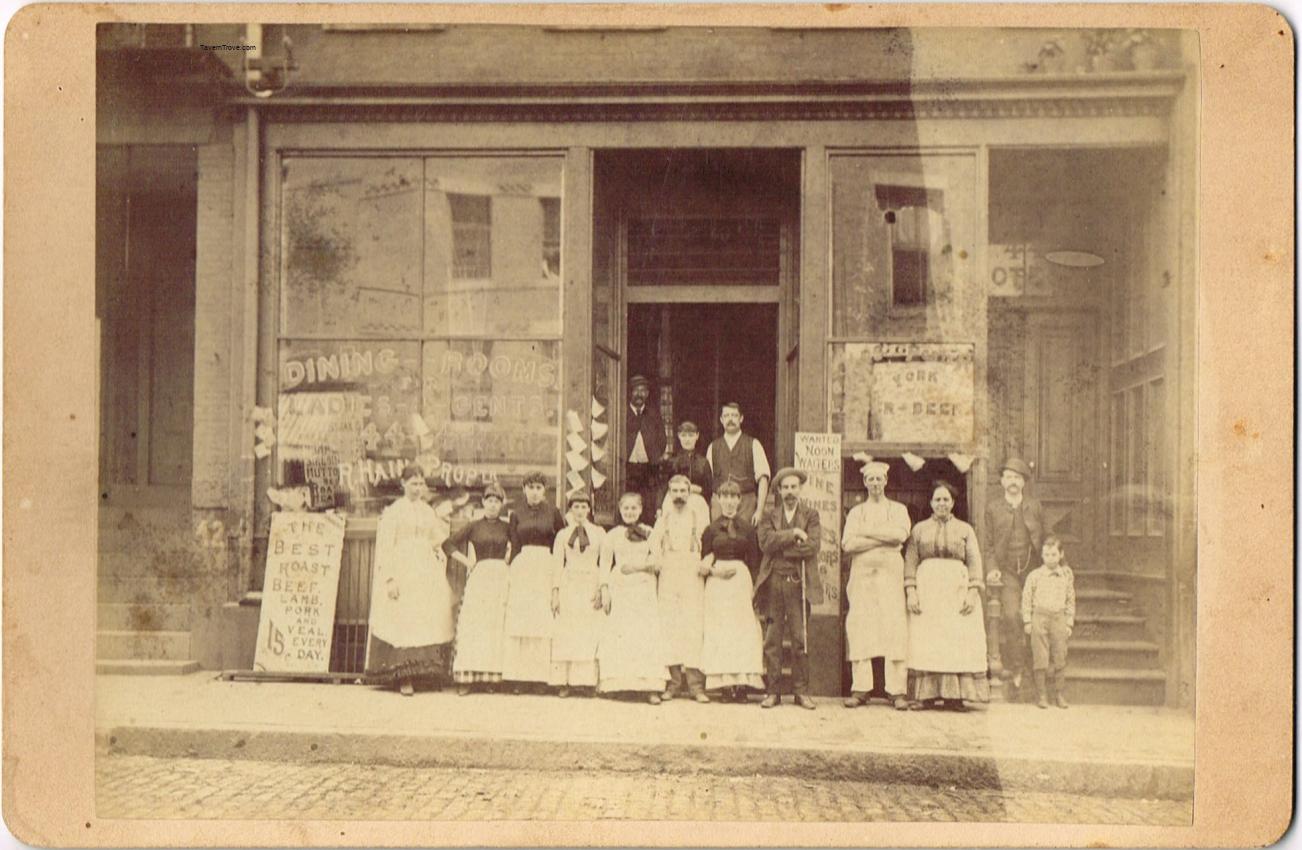 Cafe Exterior with Employees and Signs