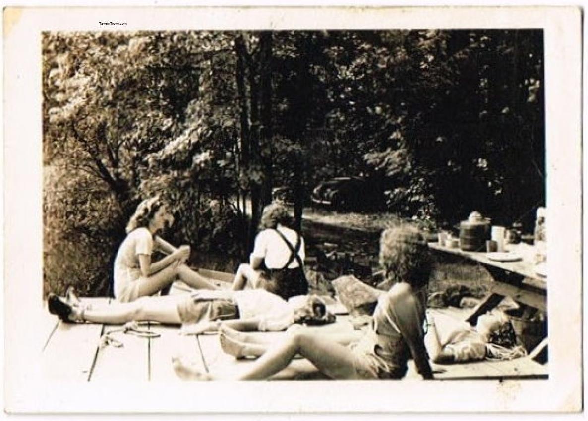 Girls Sunbathing in a Park