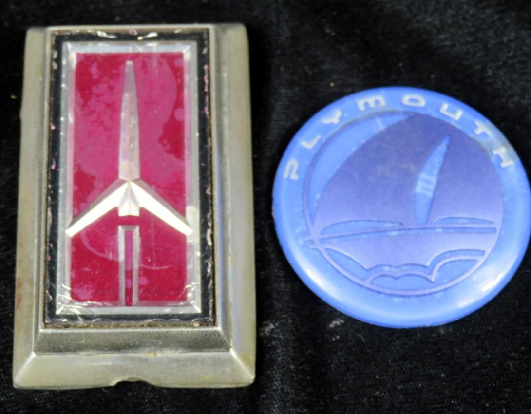 Plymouth Voyager and Oldsmobile Cutlass Ciera Badges