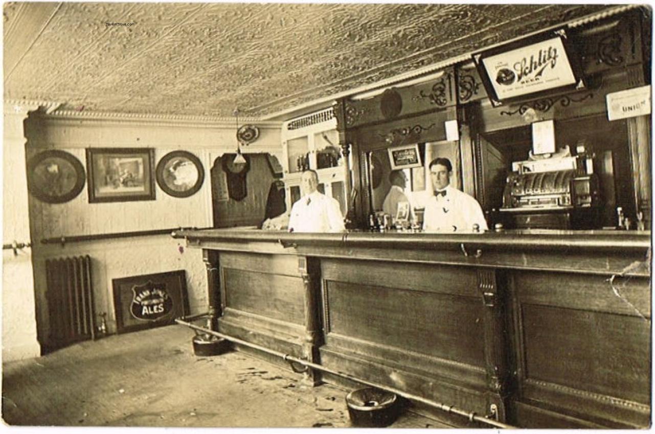 Frank Jones, Schlitz and Rueter signs in Saloon Interior
