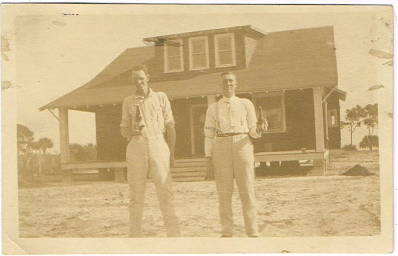Schlitz Bottles Two Men In Front Of A House RPPC