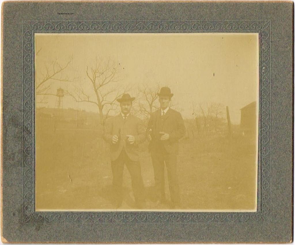 Two Men Drink Unknown Beer Alfresco